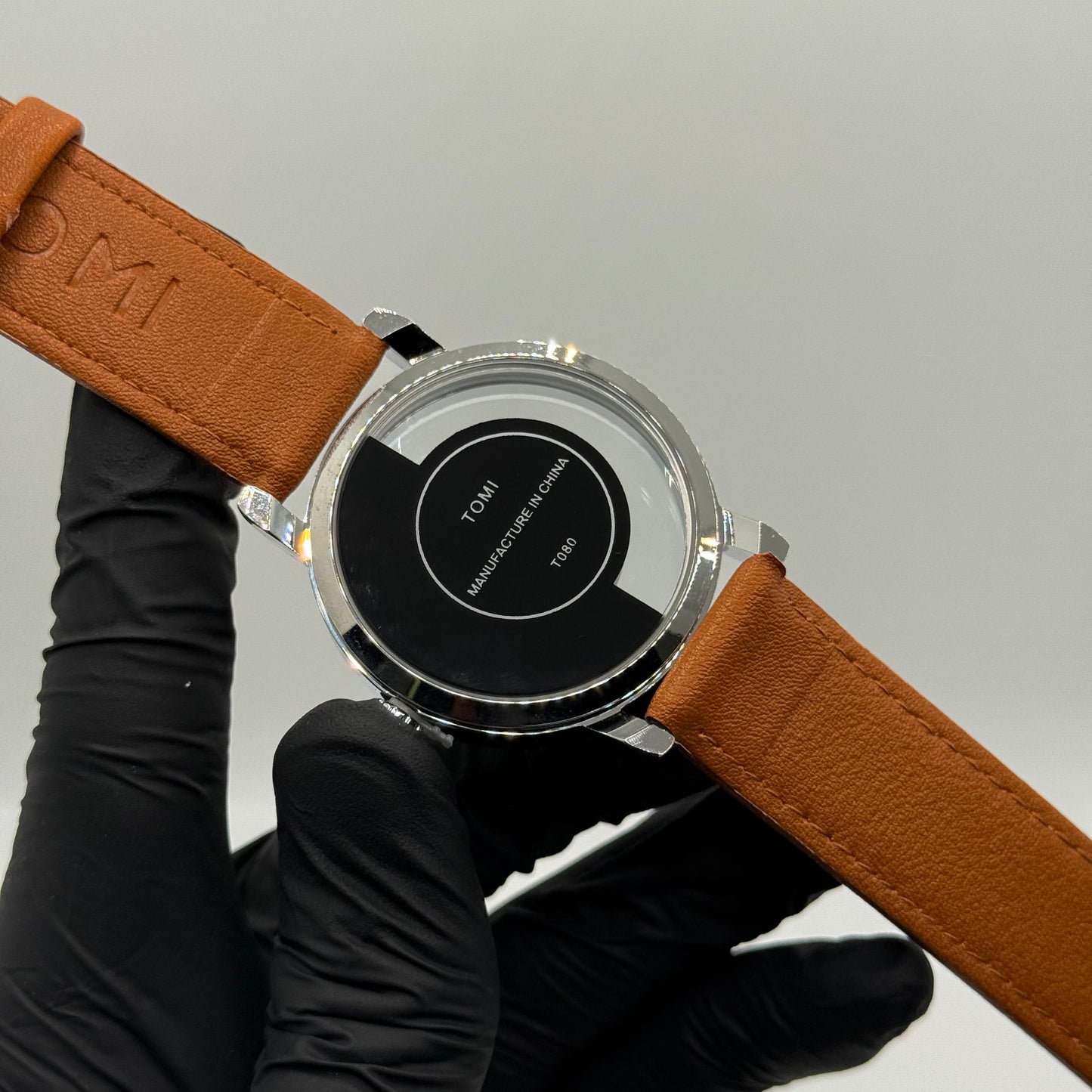 TOMI transparent dial with bronze leather strap - watch forge