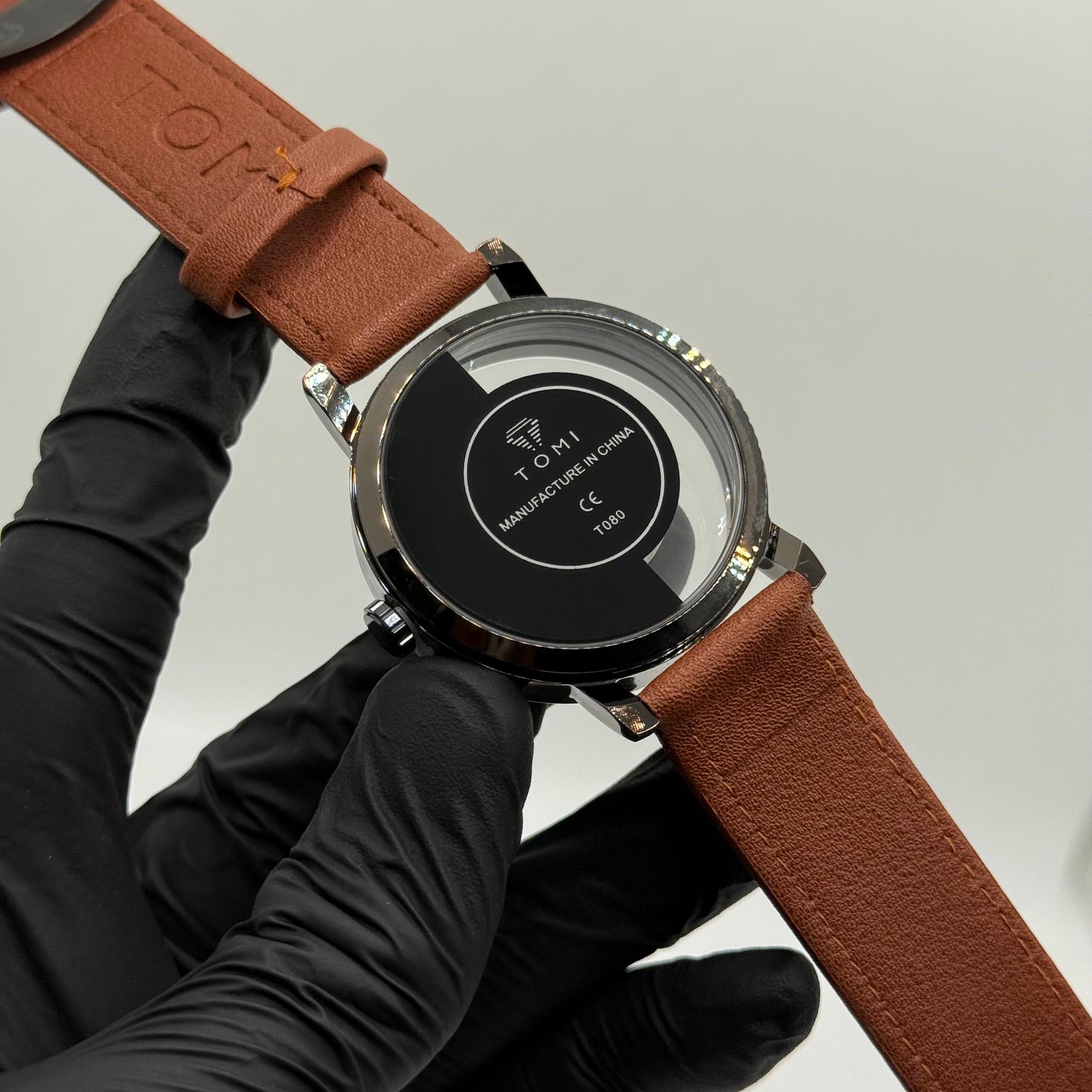 TOMI transparent dial with black leather strap - watch forge