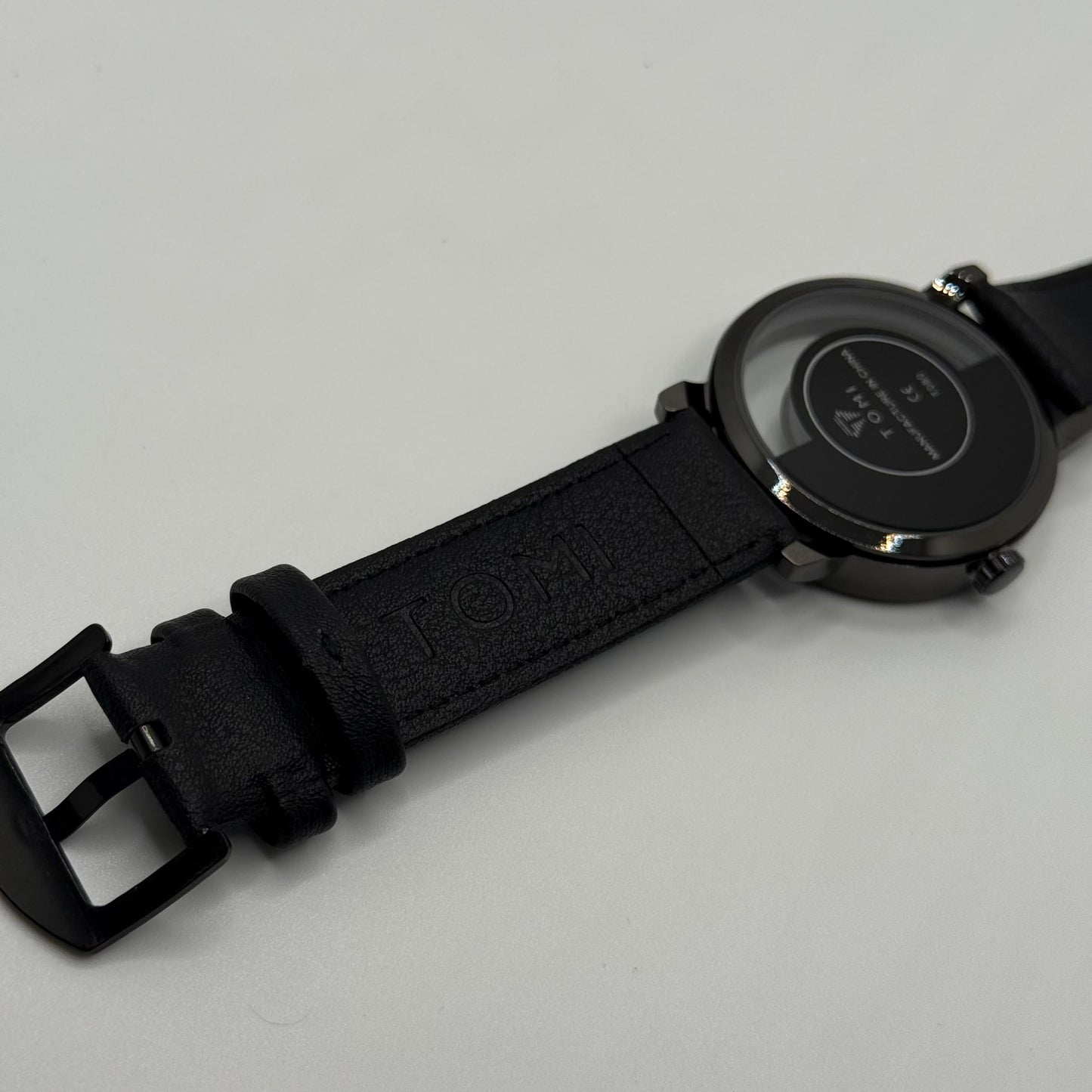 TOMI transparent dial with black leather strap - watch forge