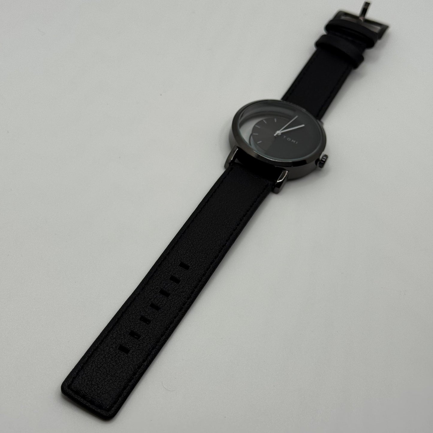 TOMI transparent dial with black leather strap - watch forge